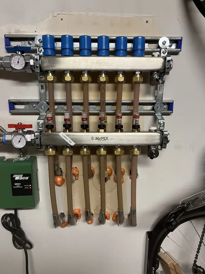 Plumber performing Water Heater Repair at a residential property in King George